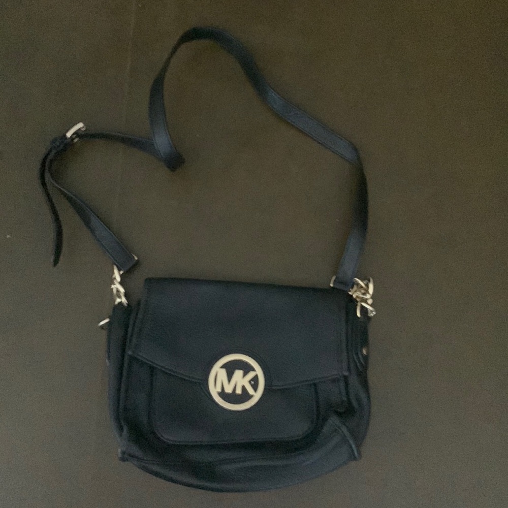 It’s a Michael Kors a black purse barely used